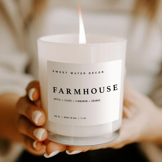 Rustic farmhouse candle with warm, spicy fragrance notes of apple, pumpkin spice, and clove, perfect for creating a homely glow.