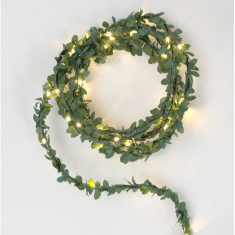Battery powered 3m LED fairy lights with warm white bulbs and delicate faux foliage.