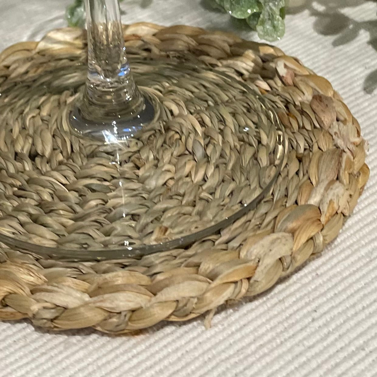 Close up of woven seagrass and water hyacinth coaster texture.