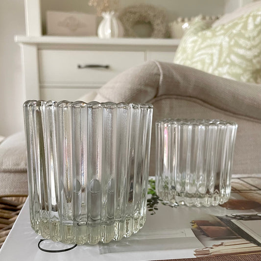 Set of ribbed tea light holders creating a cosy and elegant atmosphere in a living room.