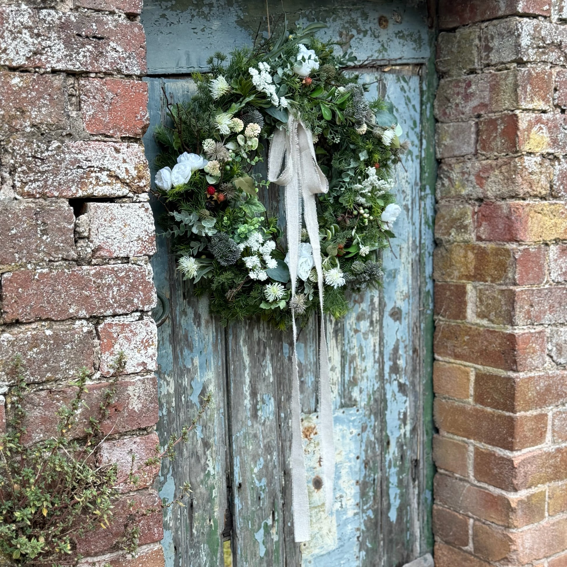 Exclusive Belle & Bramble Interiors wreath with delicate blackberries, thistles and soft seasonal blooms, capturing rustic countryside charm and timeless elegance.