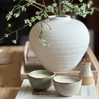 Decorative candle in a ceramic pot, designed to be enjoyed and reused for home styling once burned