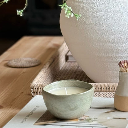 Decorative candle in a ceramic pot, designed to be enjoyed and reused for home styling once burned.