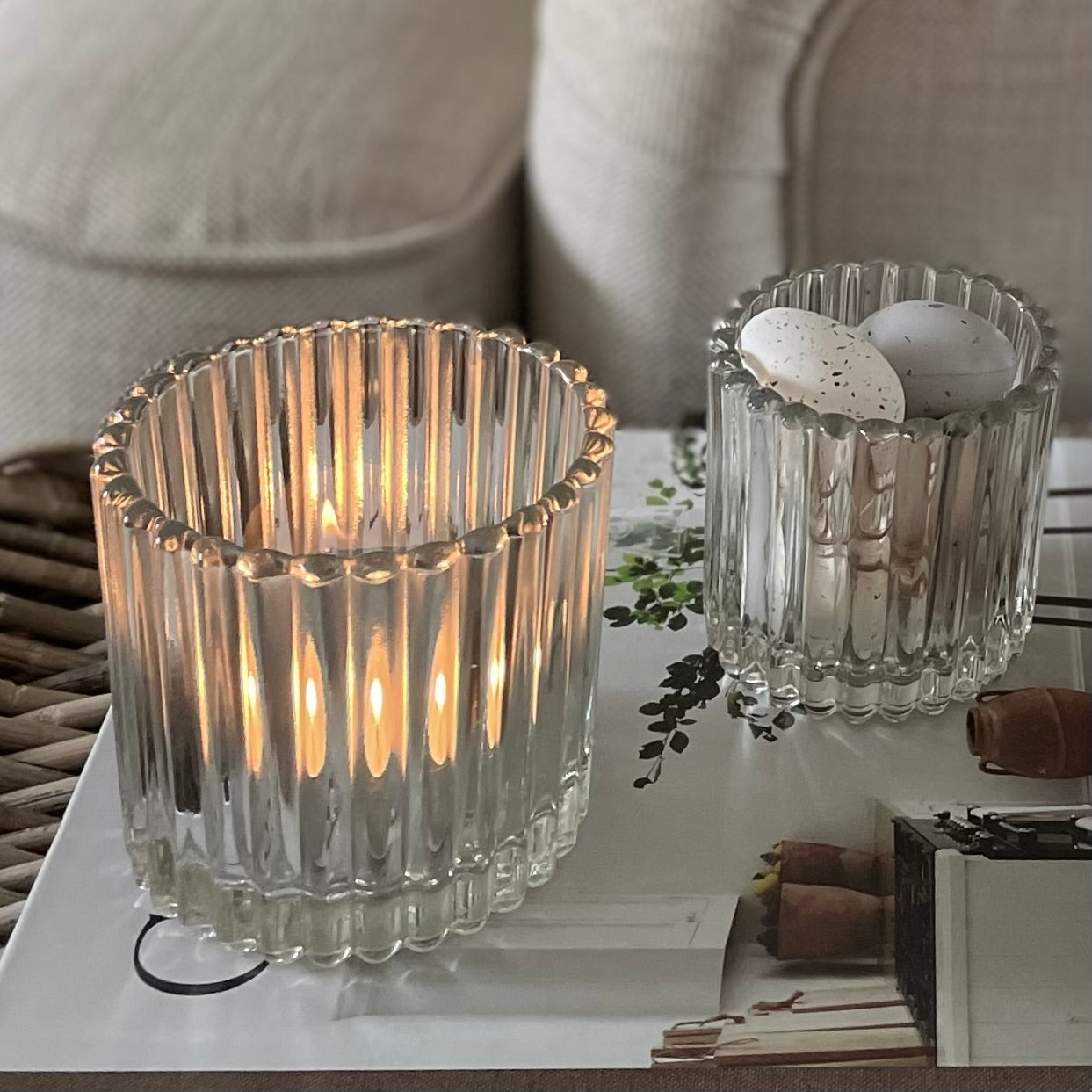 Set of ribbed candle holders creating a cosy and elegant atmosphere in a living room.