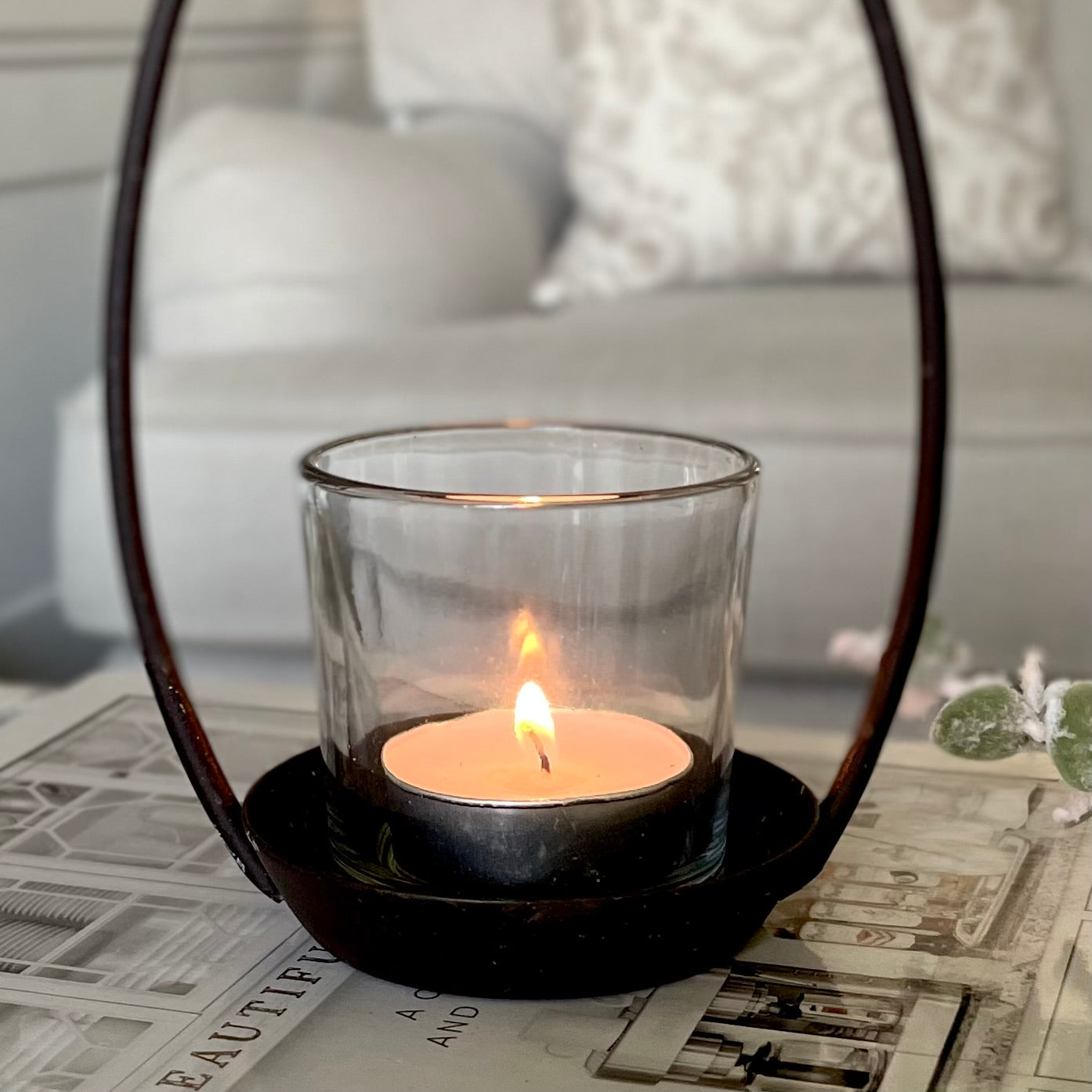Close up of star tea light holder with glass candle votive.