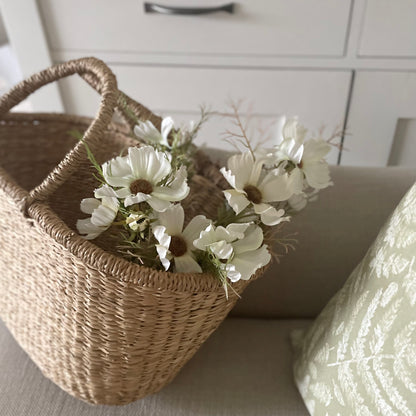 Cream Cosmos Spray with 16 realistic flower heads and buds. Styled in a seagrass shopper.