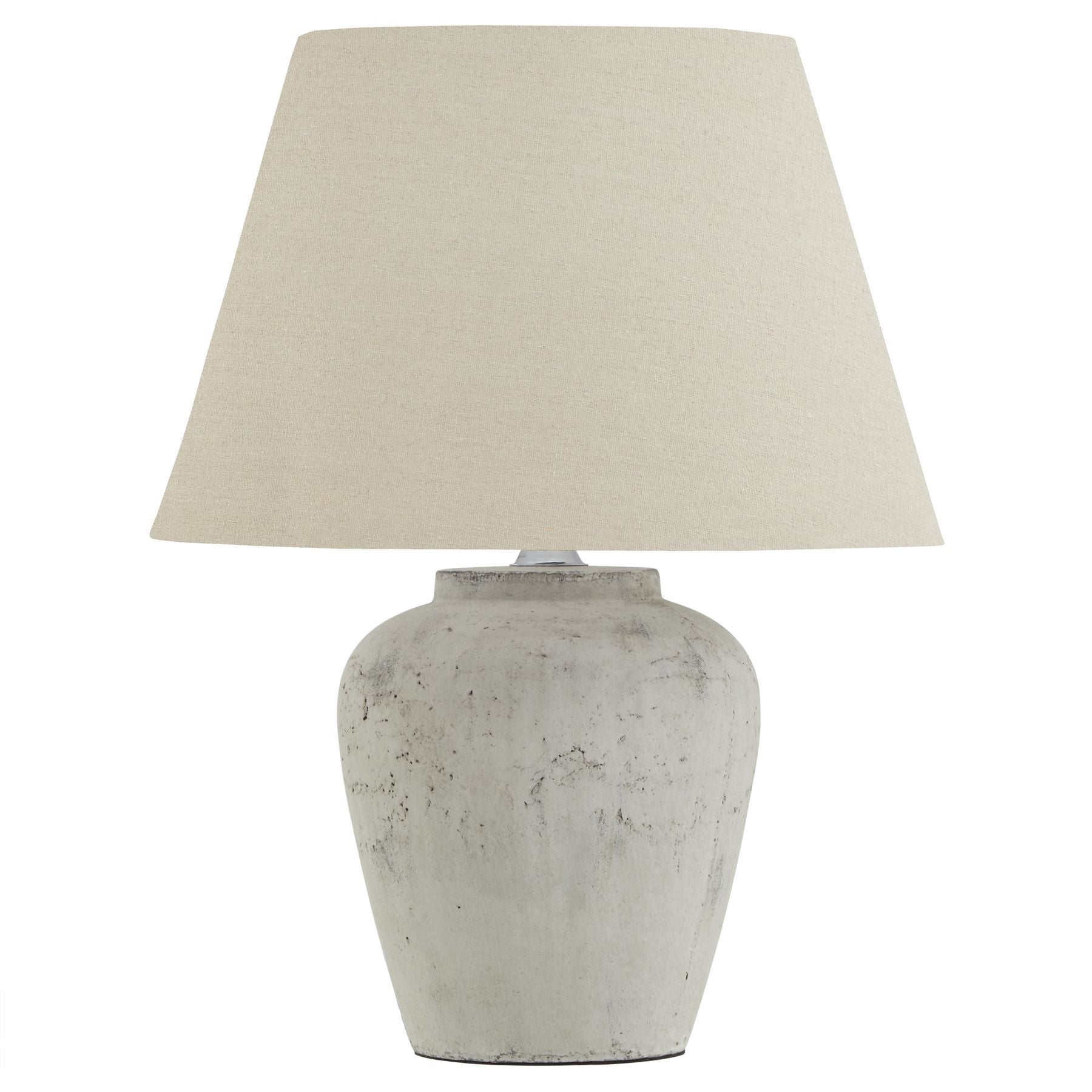 Darcy lamp with neutral stone base and linen hat shade on a white background.