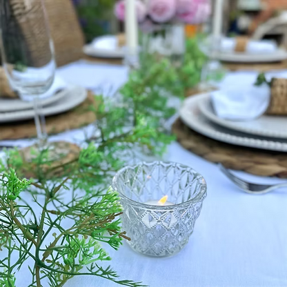 Lifelike faux elderflower garland with delicate white blooms and feathery green stems, perfect for styling tables, mirrors, or mantels.
