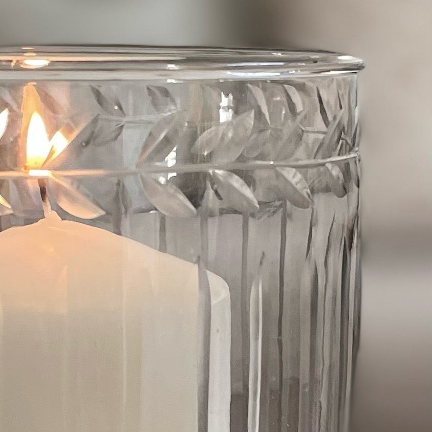 Close up of elegant decorative glass hurricane lantern.