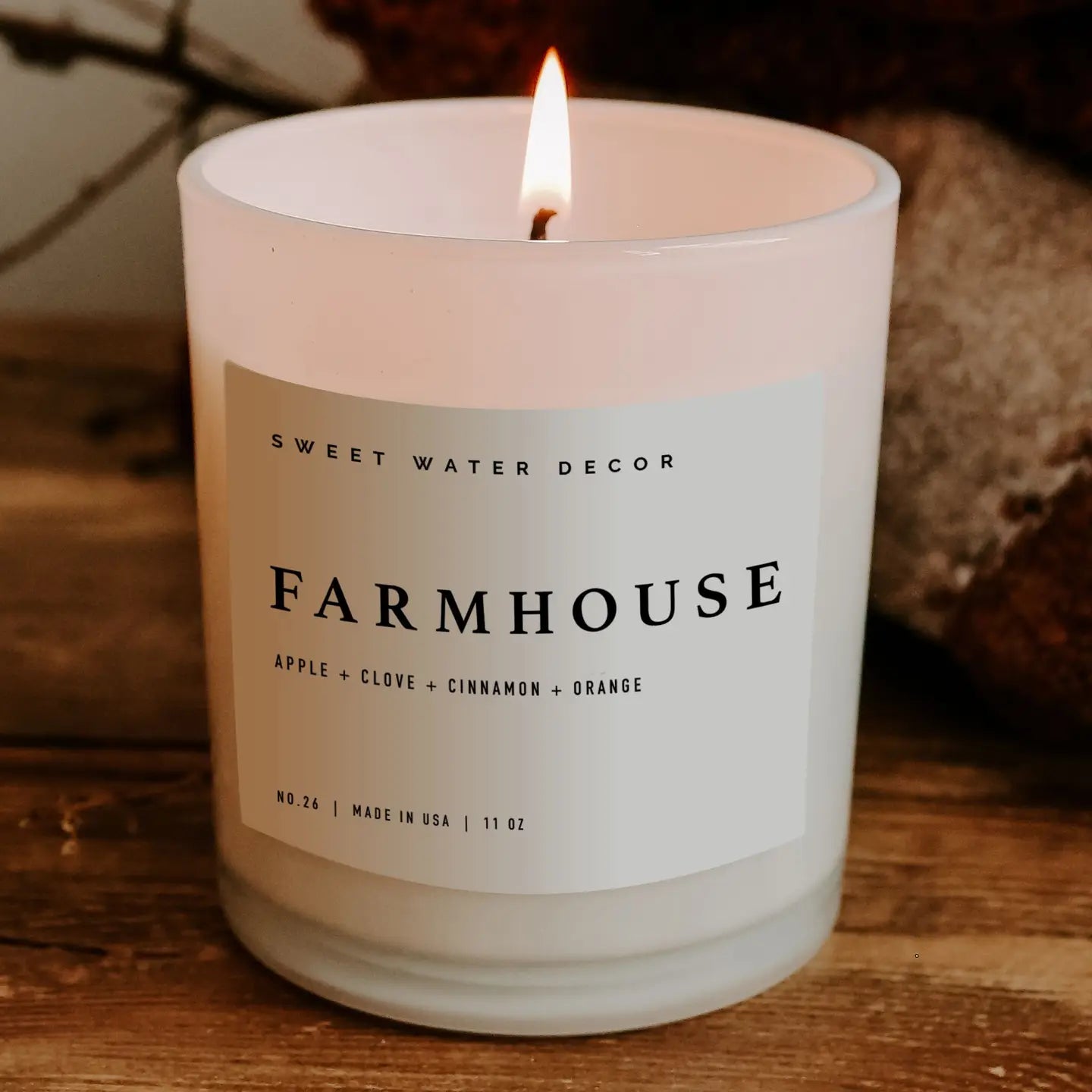 Rustic farmhouse candle with warm, spicy fragrance notes of apple, pumpkin spice, and clove, perfect for creating a homely glow.