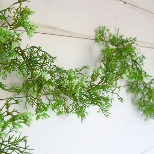 Artificial elderflower garland featuring realistic white flowers and eye loops for easy hanging around the home or garden.