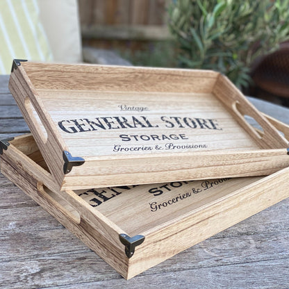 Set of 2 industrial wooden trays with metal corners and “General Store” print styled on a table.