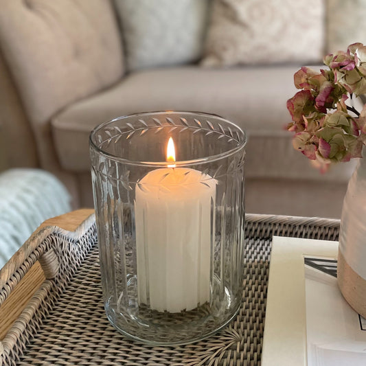 Glass hurricane lantern with leaf etched and ribbed glasswork.