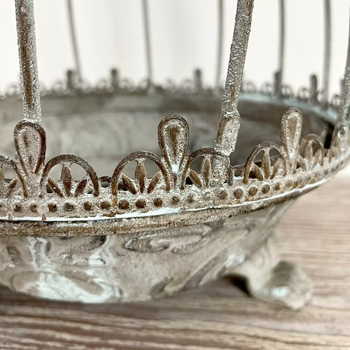 Caged metal planter in grey with Verdigris finish, styled with greenery for a timeless, rustic look.