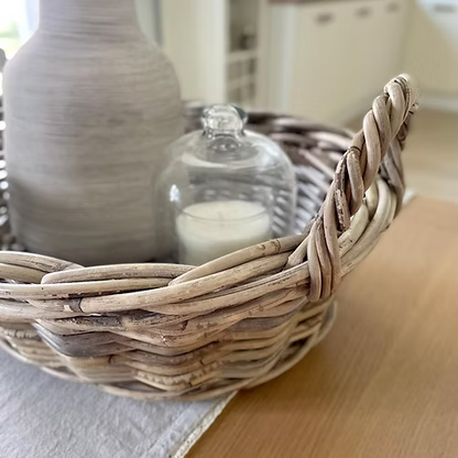 Woven basket with decorative items on a dining table