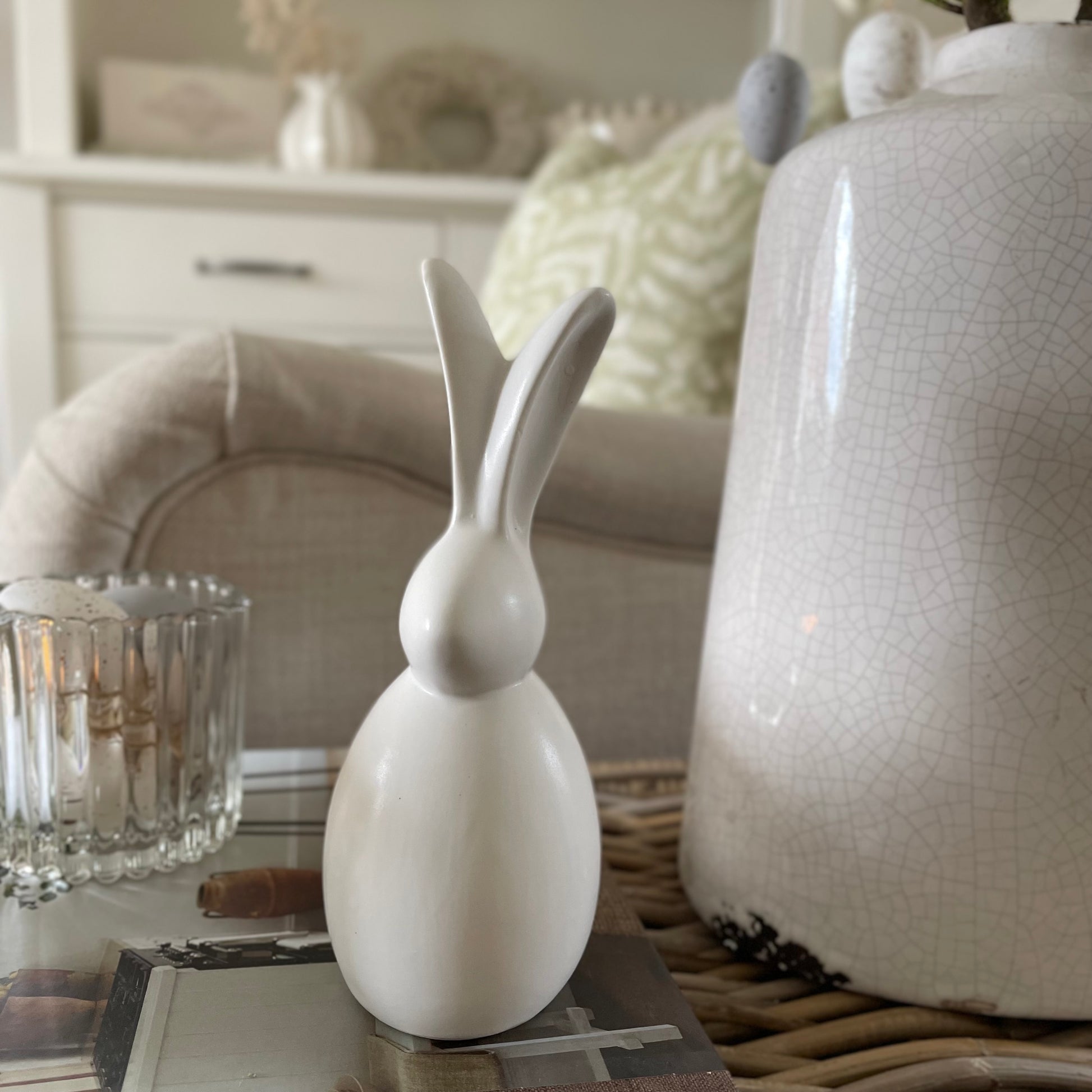 Decorative bunny styled on coffee table for Easter.