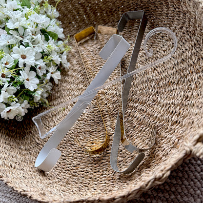 Assorted coloured metal wreath holders displayed together, showcasing their sturdy design and versatile home decor use.