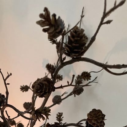 Natural faux mini pine cone branch for festive arrangements.
