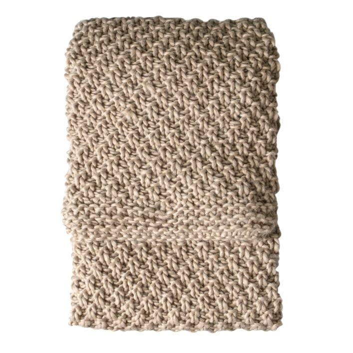 Chunky moss knitted oatmeal throw shown on a white background.
