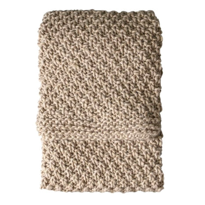 Chunky moss knitted oatmeal throw shown on a white background.