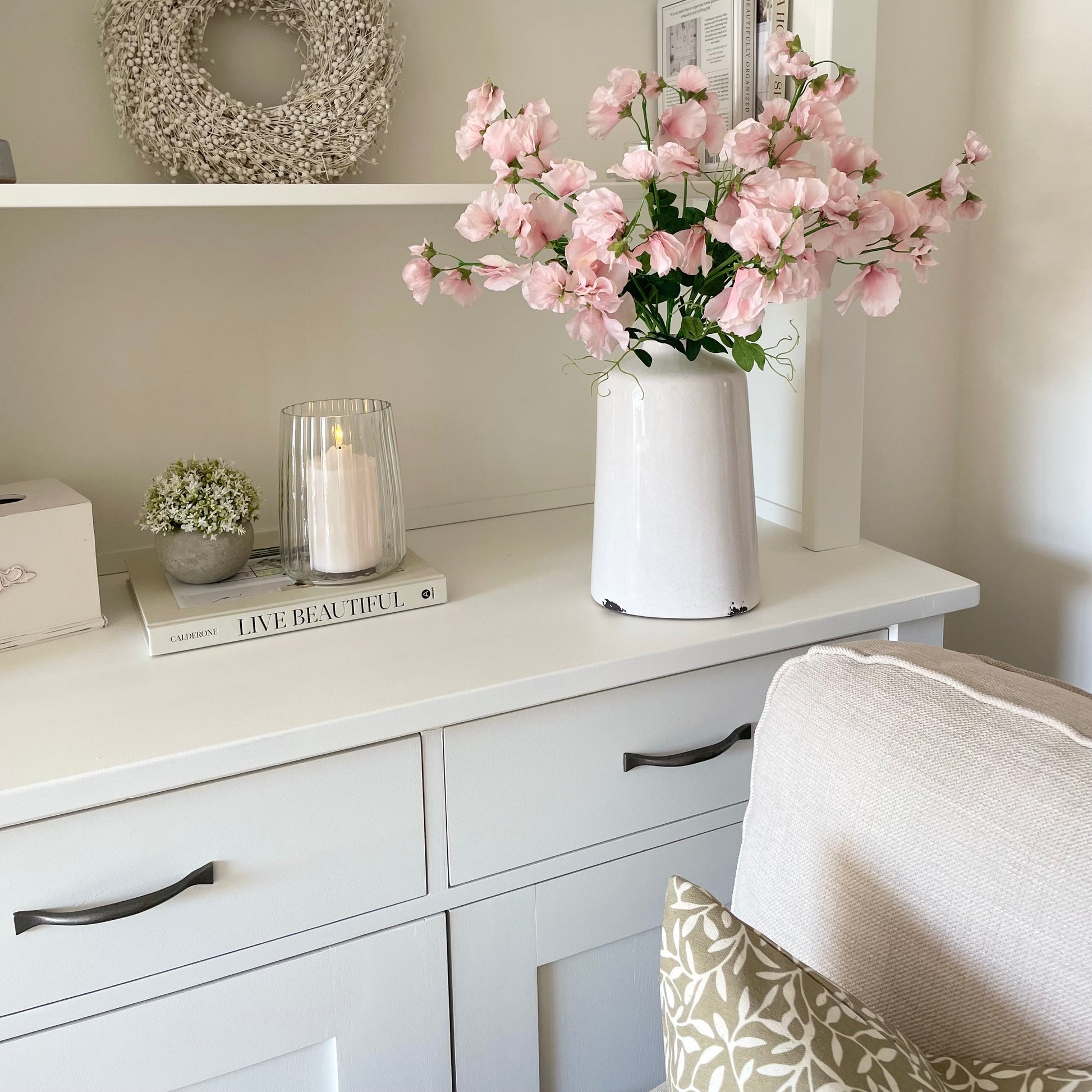 Lifelike pink sweet pea flowers with delicate petals creating a timeless floral arrangement.