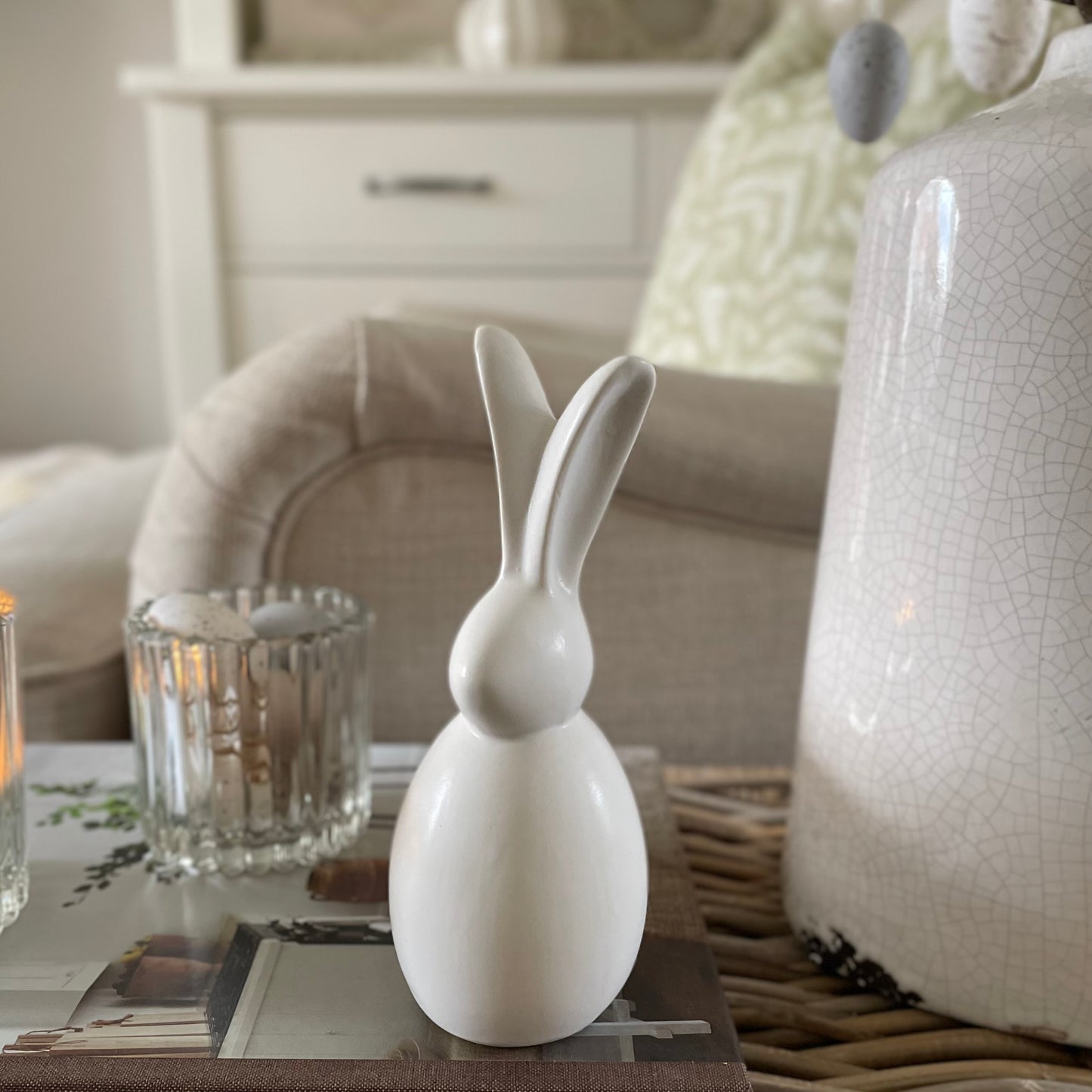 Porcelain sitting bunny for Spring and Easter decor. Styled on a book.