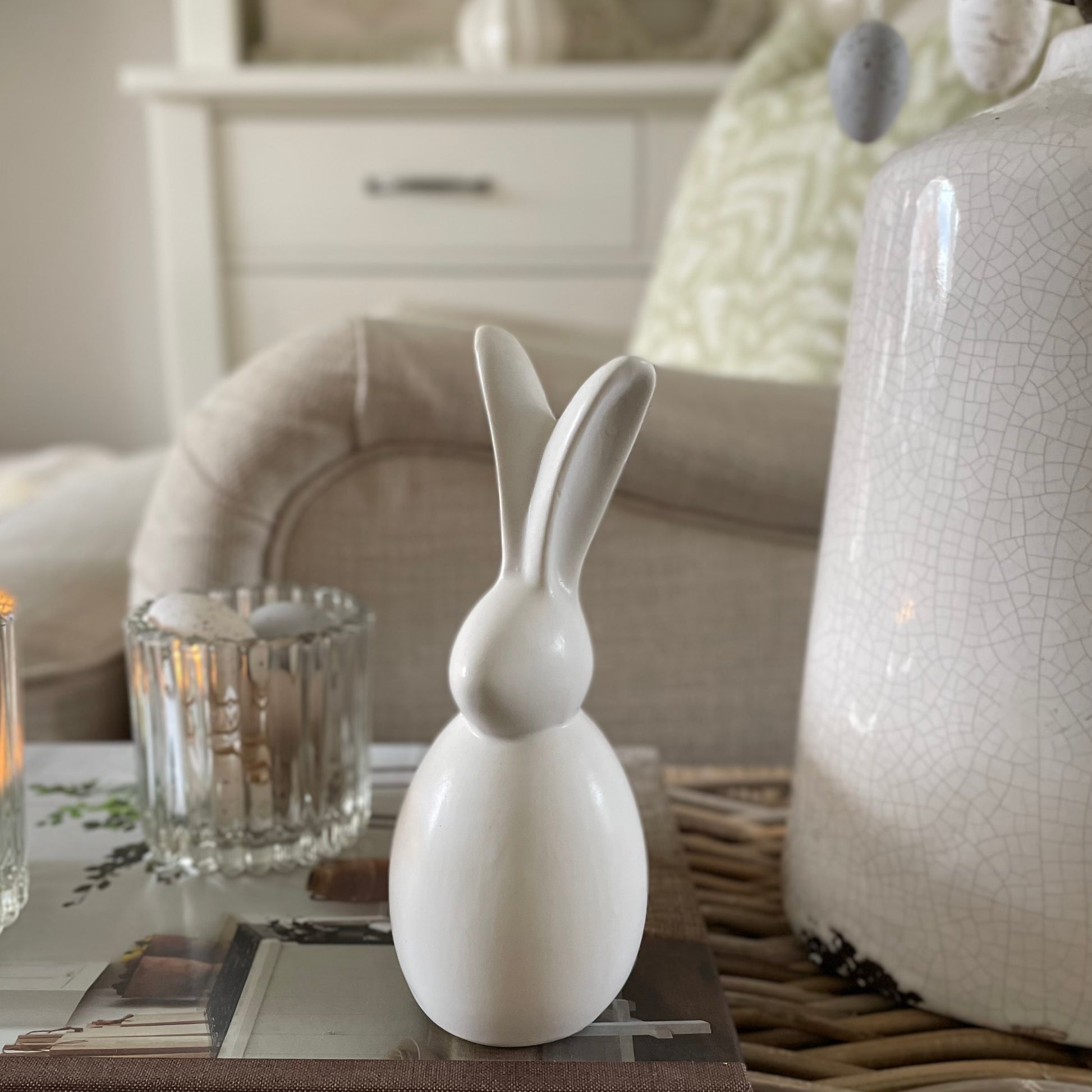 Porcelain sitting bunny for Spring and Easter decor. Styled on a book.