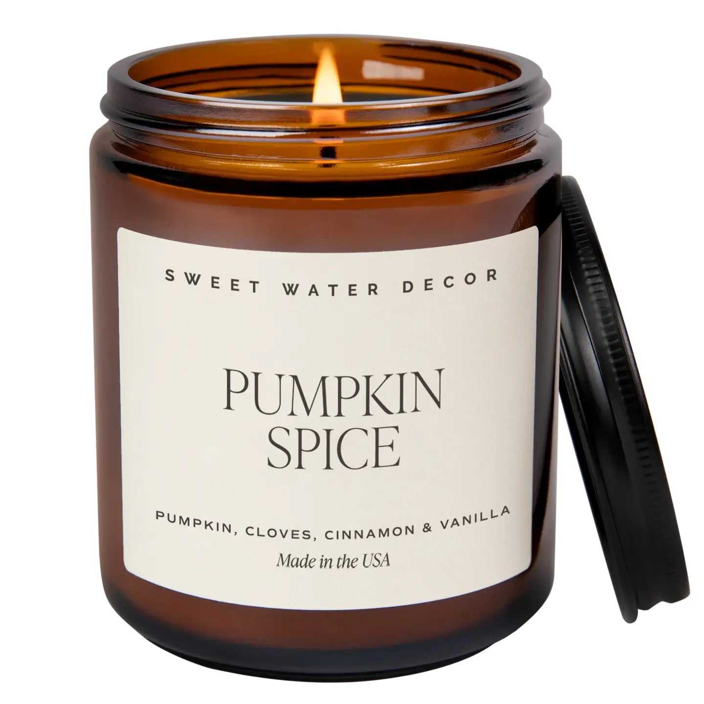Pumpkin spice candle in amber glass jar. Scents of pumpkin, cloves, cinnamon and vanilla.