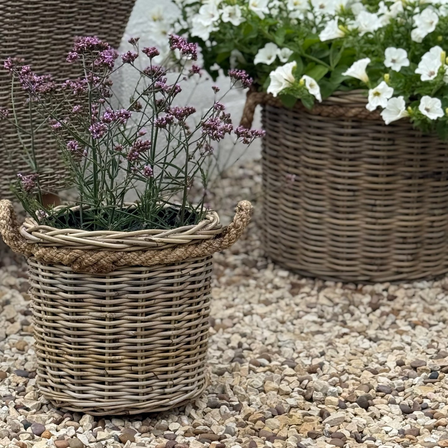 Handcrafted rattan planter with hidden plastic liner, perfect for front doors, patios, or garden corners
