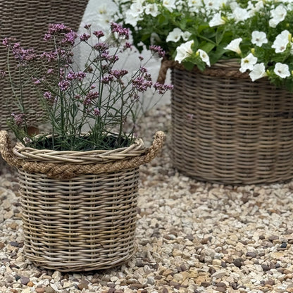 Handcrafted rattan planter with hidden plastic liner, perfect for front doors, patios, or garden corners
