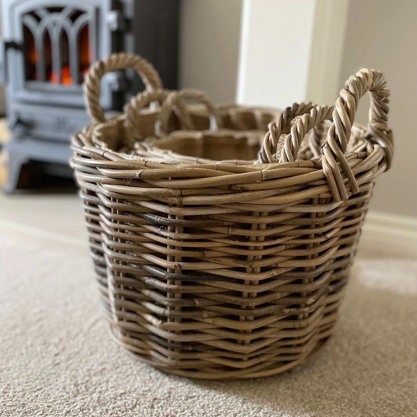 Rustic rattan storage basket in small, medium, or large, adding texture and practicality to a living room.