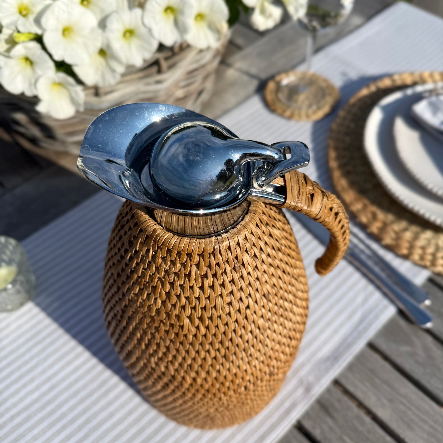 Rattan wrapped thermos jug, 2 litre capacity, perfect for keeping drinks hot or cold in timeless style.