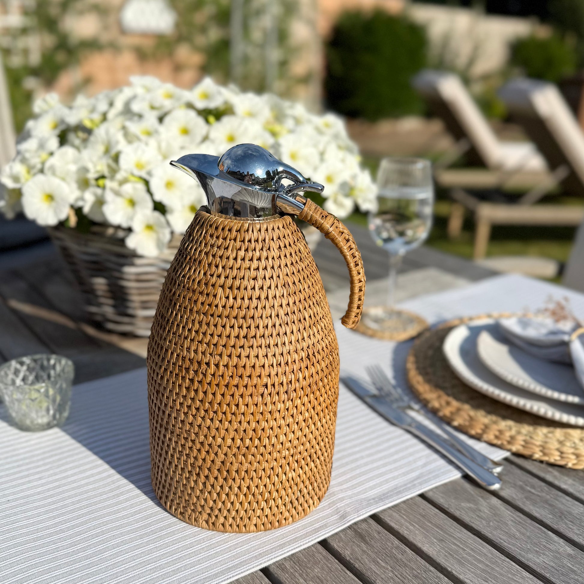 Rattan wrapped thermos jug, 2 litre capacity, perfect for keeping drinks hot or cold in timeless style.
