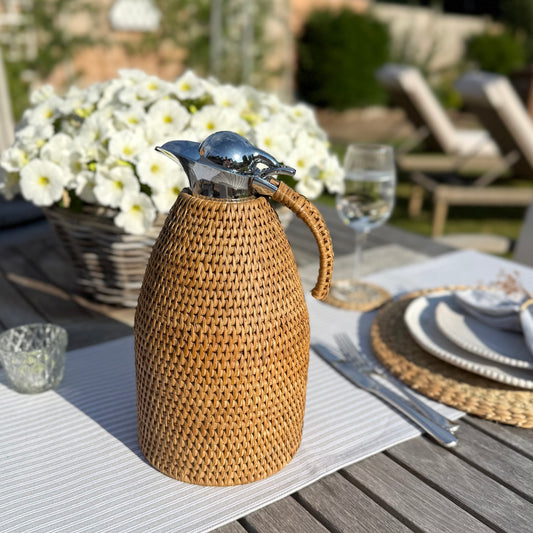 Rattan wrapped thermos jug, 2 litre capacity, perfect for keeping drinks hot or cold in timeless style.