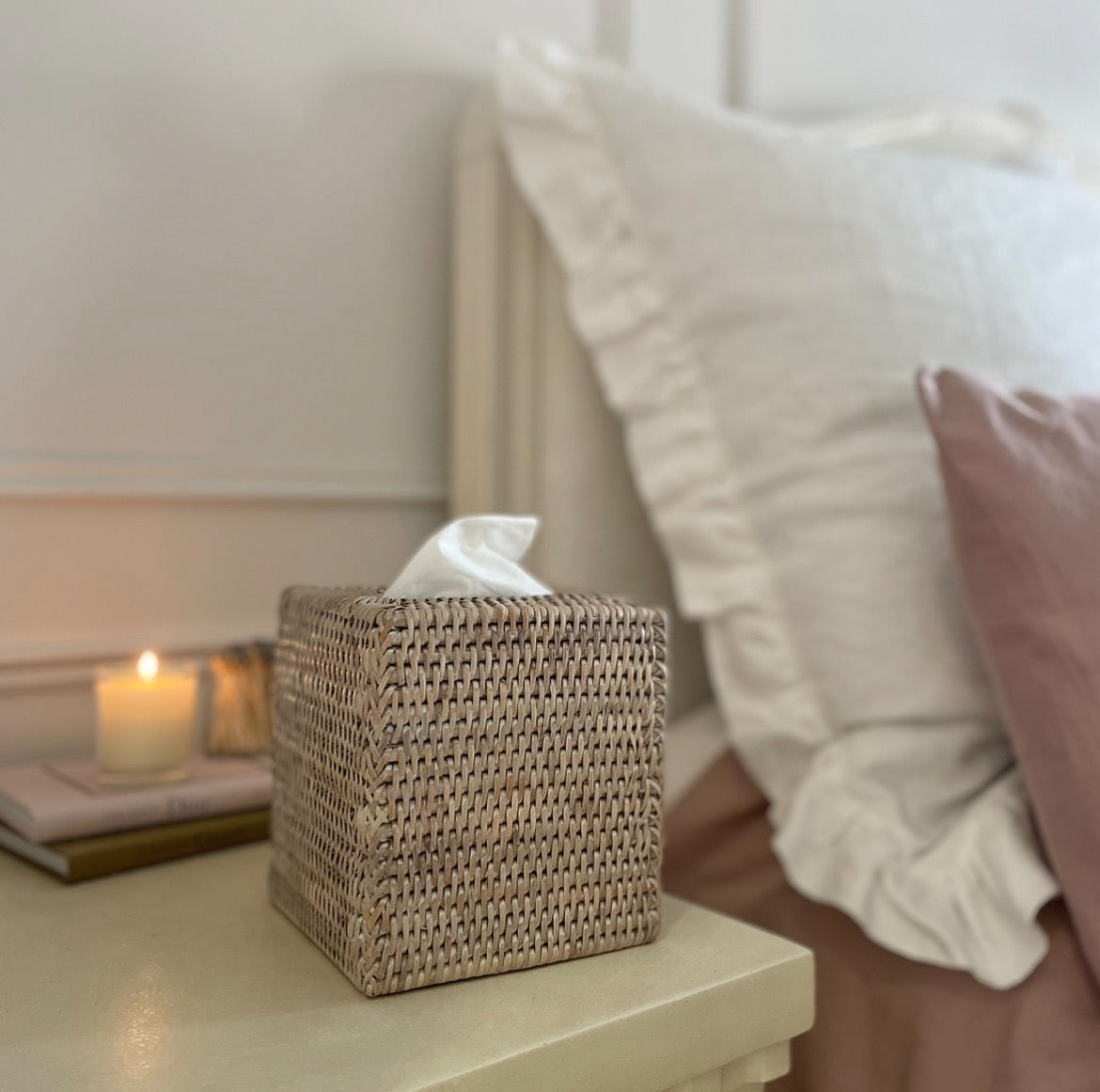 Ethically sourced rattan tissue box cover styled on bedside table. 