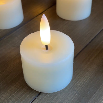 Close up of real wax LED candle with timer feature. Styled on a rustic table.