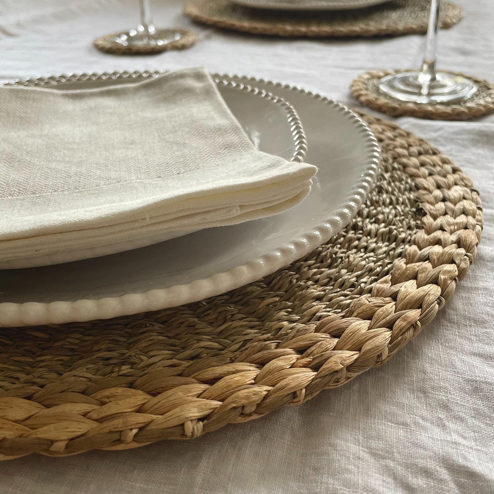 Close up of woven seagrass and water hyacinth textured placemats.