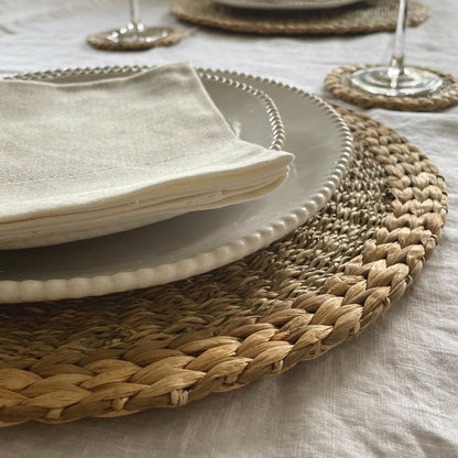 Close up of woven seagrass and water hyacinth textured placemats.