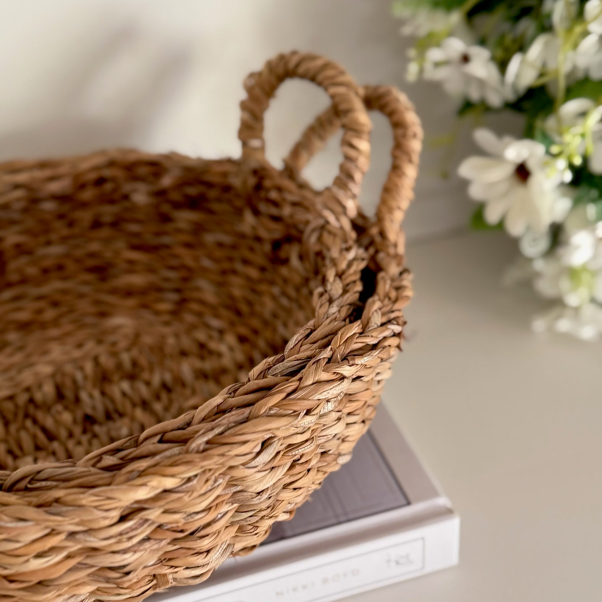 Timeless woven basket for bathroom, kitchen, or hallway styling, combining storage and decorative function.
