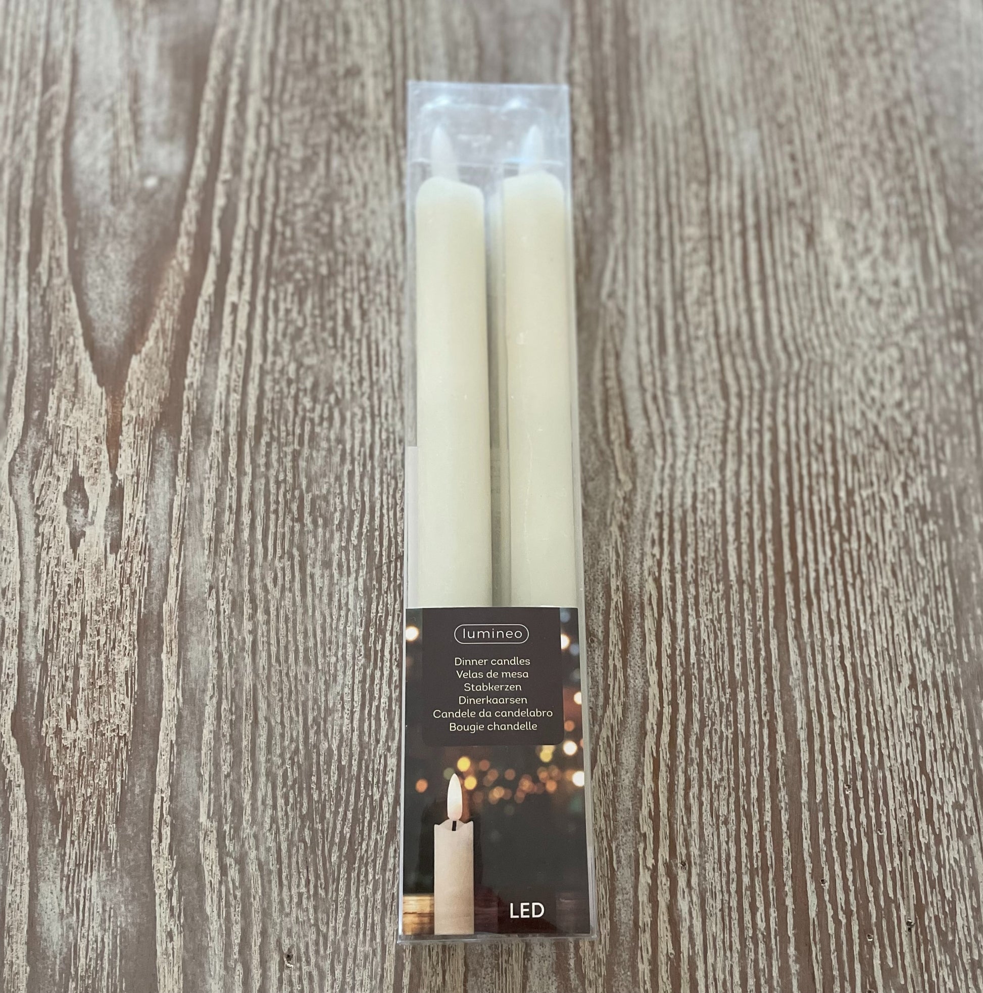 Set of 2 LED dinner candles with realistic flickering flame, 24 cm tall, styled on a dining table.
