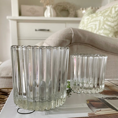 Set of ribbed tea light holders creating a cosy and elegant atmosphere in a living room.