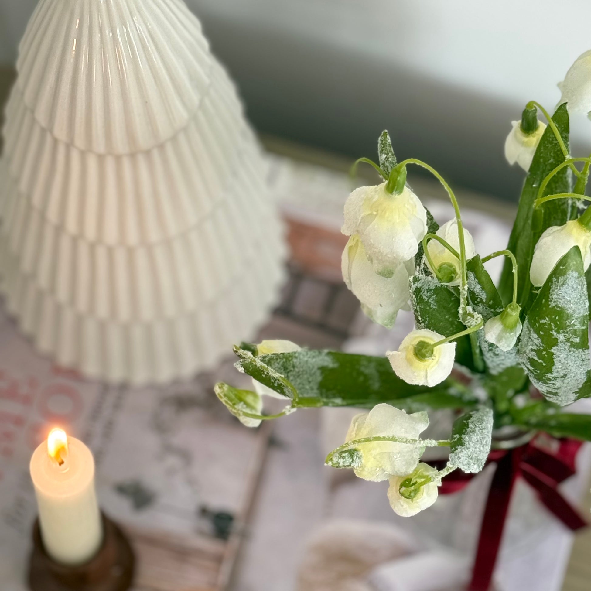 Realistic frosted snowdrop stem with delicate white blooms and soft frosted detail. Perfect for elegant winter home decor styling.