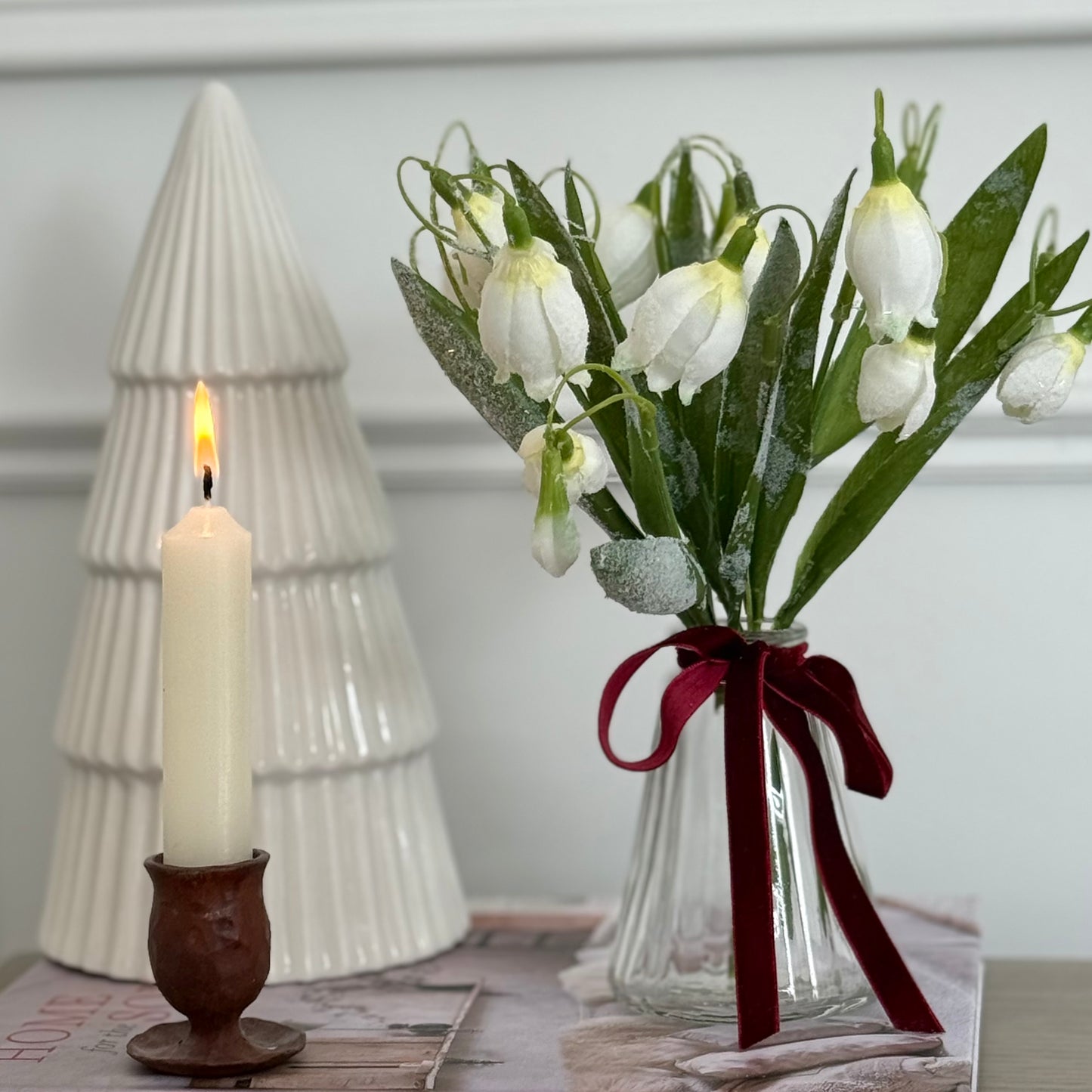 Realistic frosted snowdrop stem with delicate white blooms and soft frosted detail. Perfect for elegant winter home decor styling.