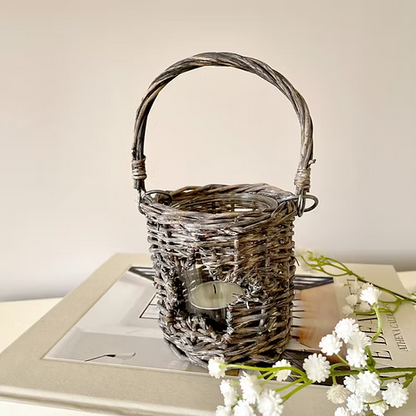 Star shaped cut out wicker candle holder with glass insert, available in two sizes, adding country charm to a room.