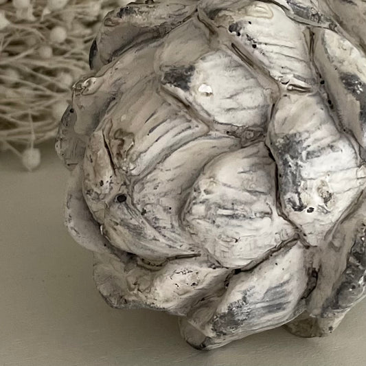 Close up of textured decorative artichoke. Stone effect, detailing.