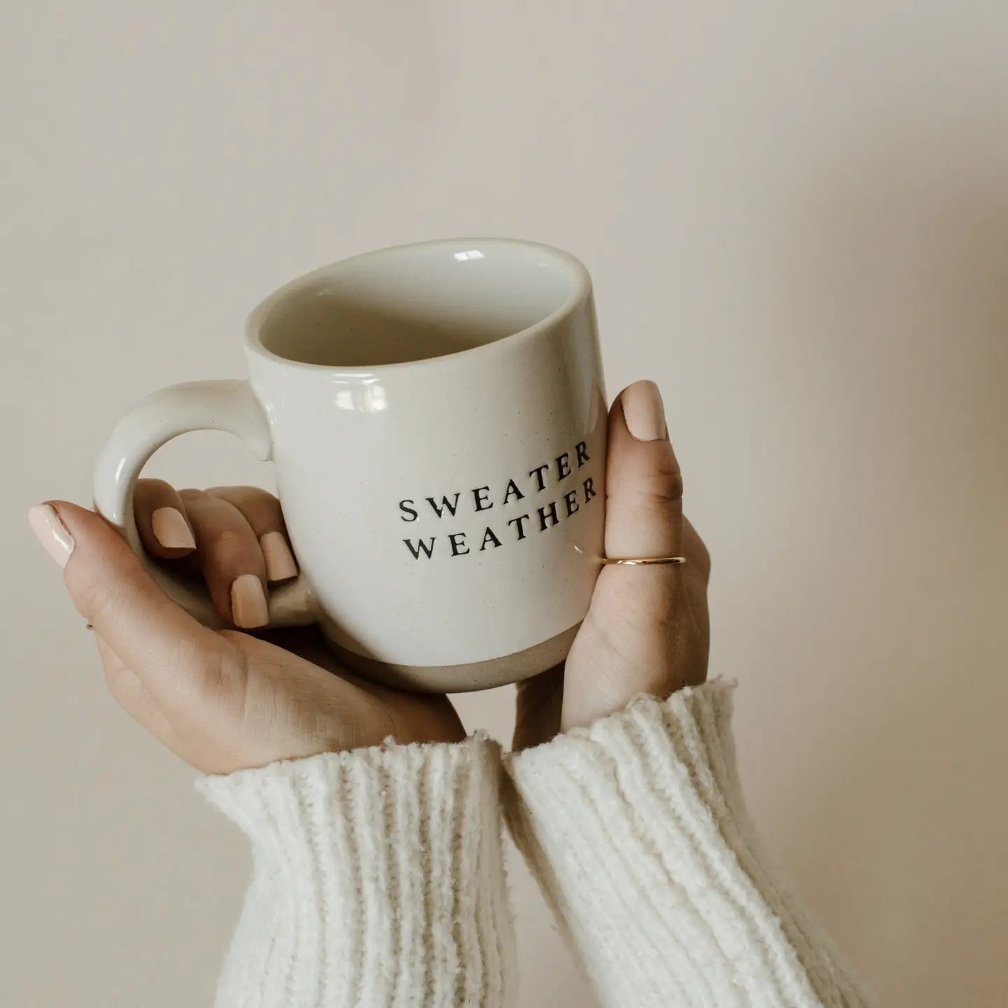 Handmade organic stoneware mug with unique glaze. With the words sweater weather.
