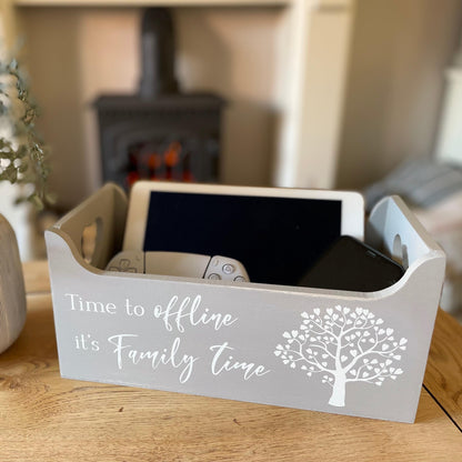 Hand painted grey wooden crate with whitewashed finish and heart cut out detail, styled on a coffee table.