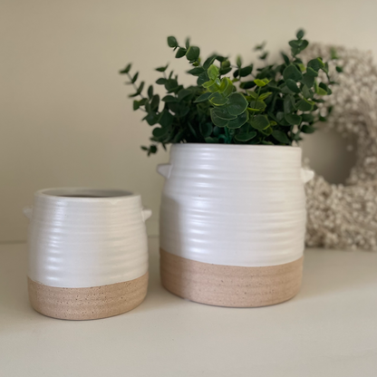 Stylish rustic two tone pot for kitchen or side table decor, combining function and charm.