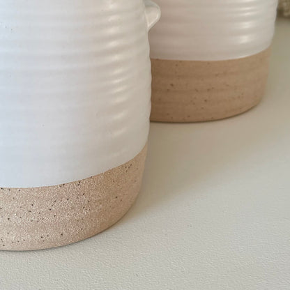 Close up of two tone white and stone pot.