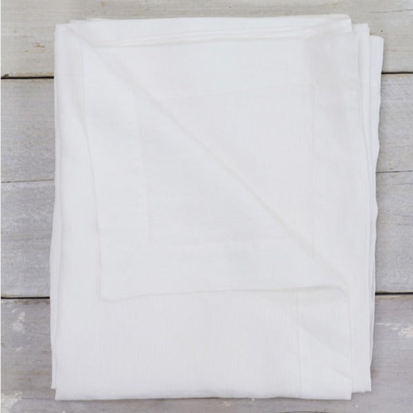 100% natural linen tablecloth on dining table.